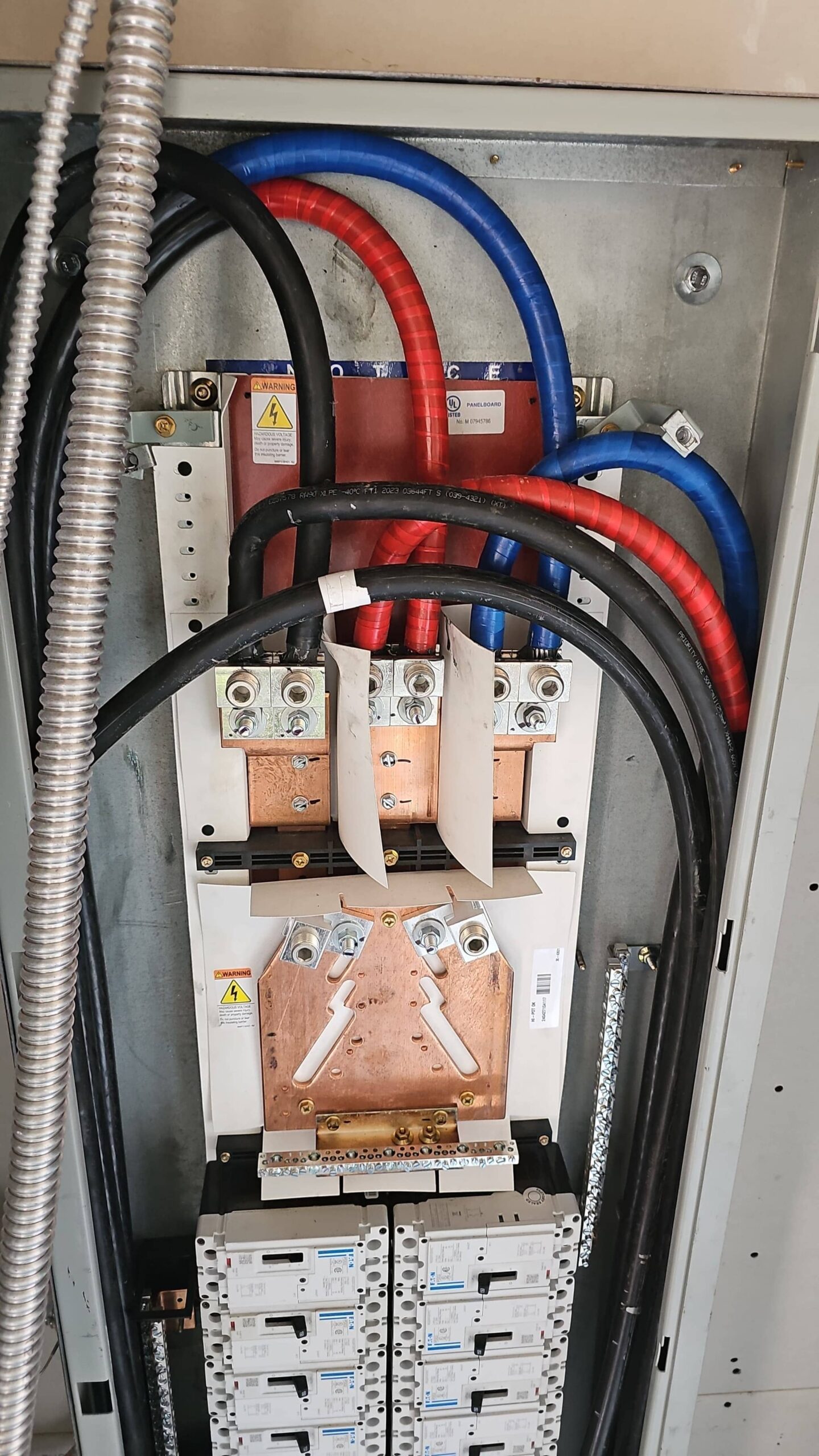 Panel relocation in Sherman Oaks with code-clear working space and neat exterior conduit